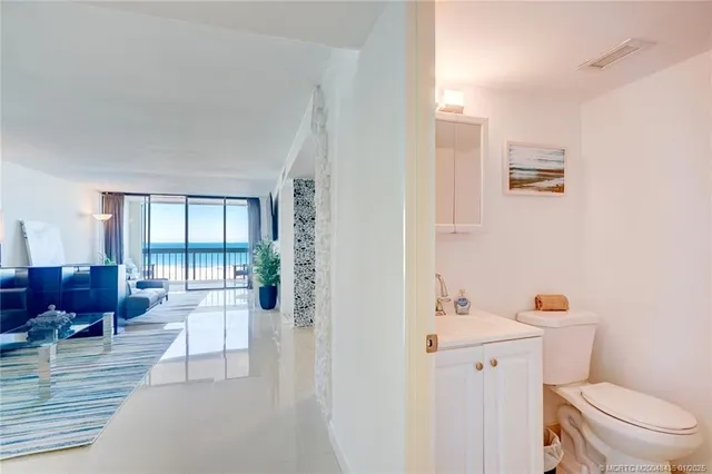a bathroom with a toilet sink tub and mirror