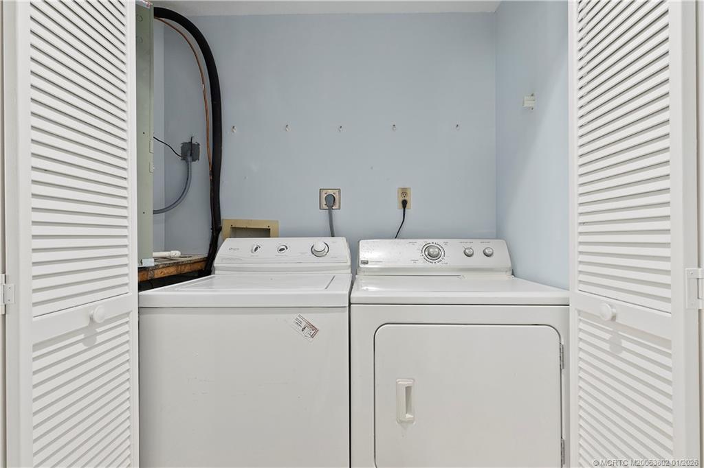 6122 Southeast Landing Way, Unit 4 Stuart, FL 34997 - Photo 13 of 23 a utility room with dryer and washer