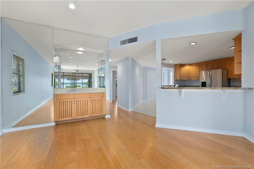6122 Southeast Landing Way, Unit 4 Stuart, FL 34997 - Photo 15 of 23 a view of a kitchen with a sink and a large window
