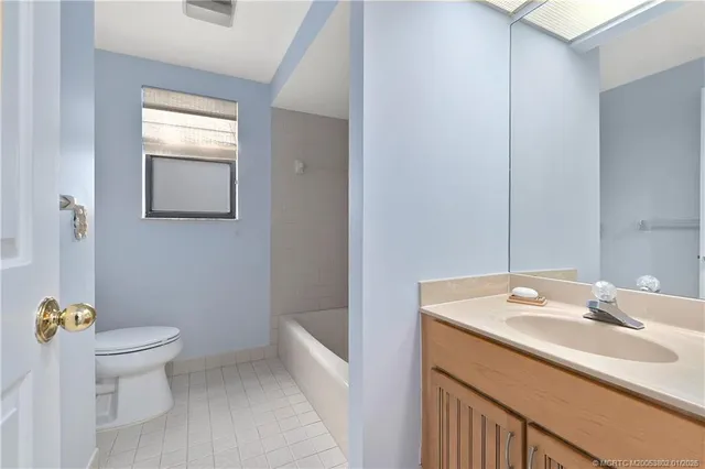 a bathroom with a sink toilet and vanity