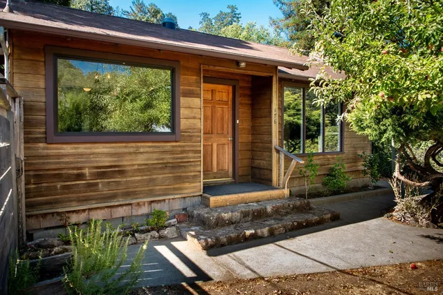a front view of a house with garden
