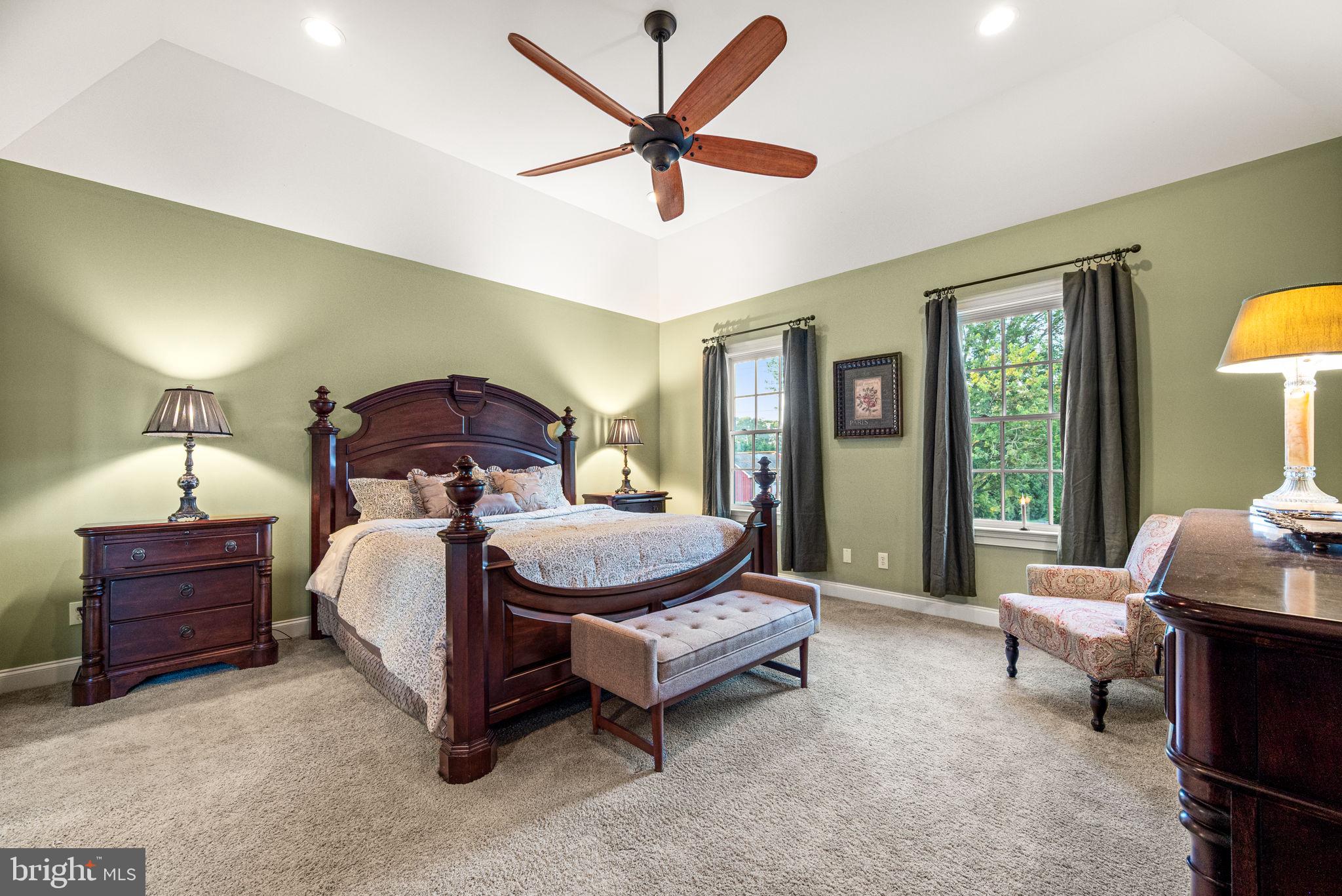1548 Morstein Road Malvern, PA 19355 - Photo 40 of 80 a bedroom with a bed and a chandelier