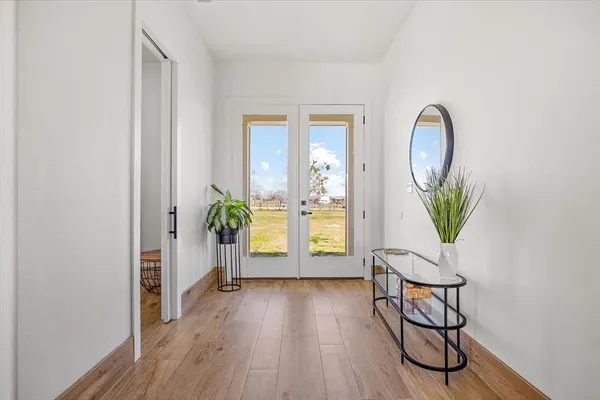 a view of a livingroom with furniture and wooden floor