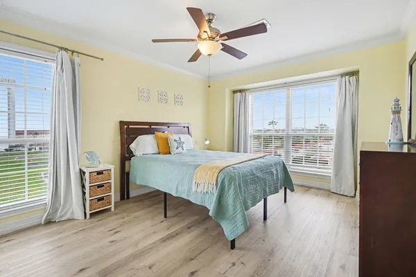 a bedroom with a large bed and a tv