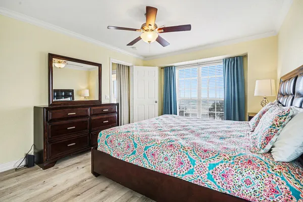 a bedroom with a bed and a dresser