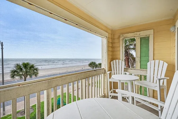 a view of balcony with furniture