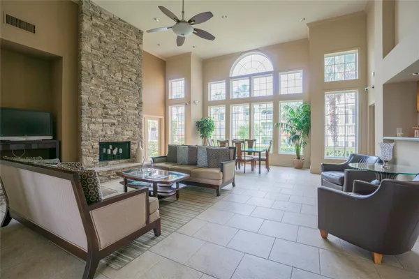 a living room with fireplace furniture and a flat screen tv