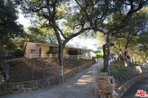 a view of a house with a tree