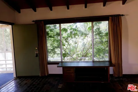 a kitchen with a stove and a refrigerator