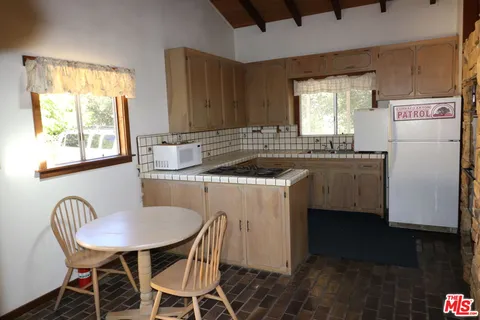 a view of a mountain range with lush green forest