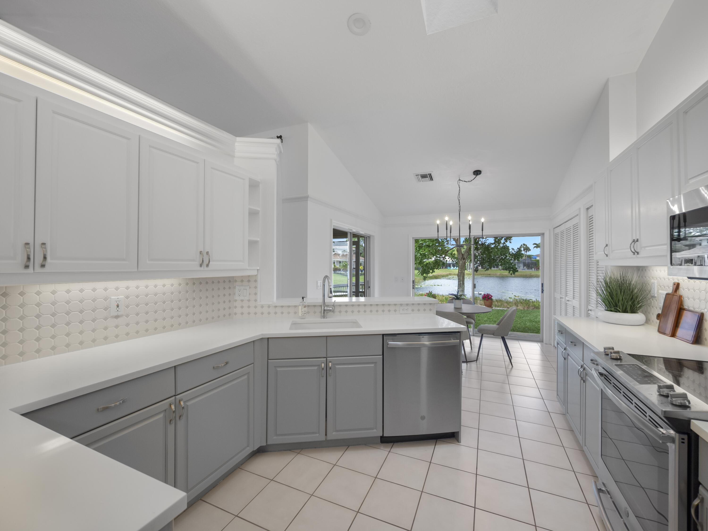 6279 Longleaf Pine Drive Jupiter, FL 33458 - Photo 6 of 33 a kitchen with a sink and cabinets