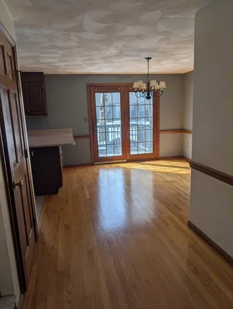 a kitchen with granite countertop a sink stove and cabinets