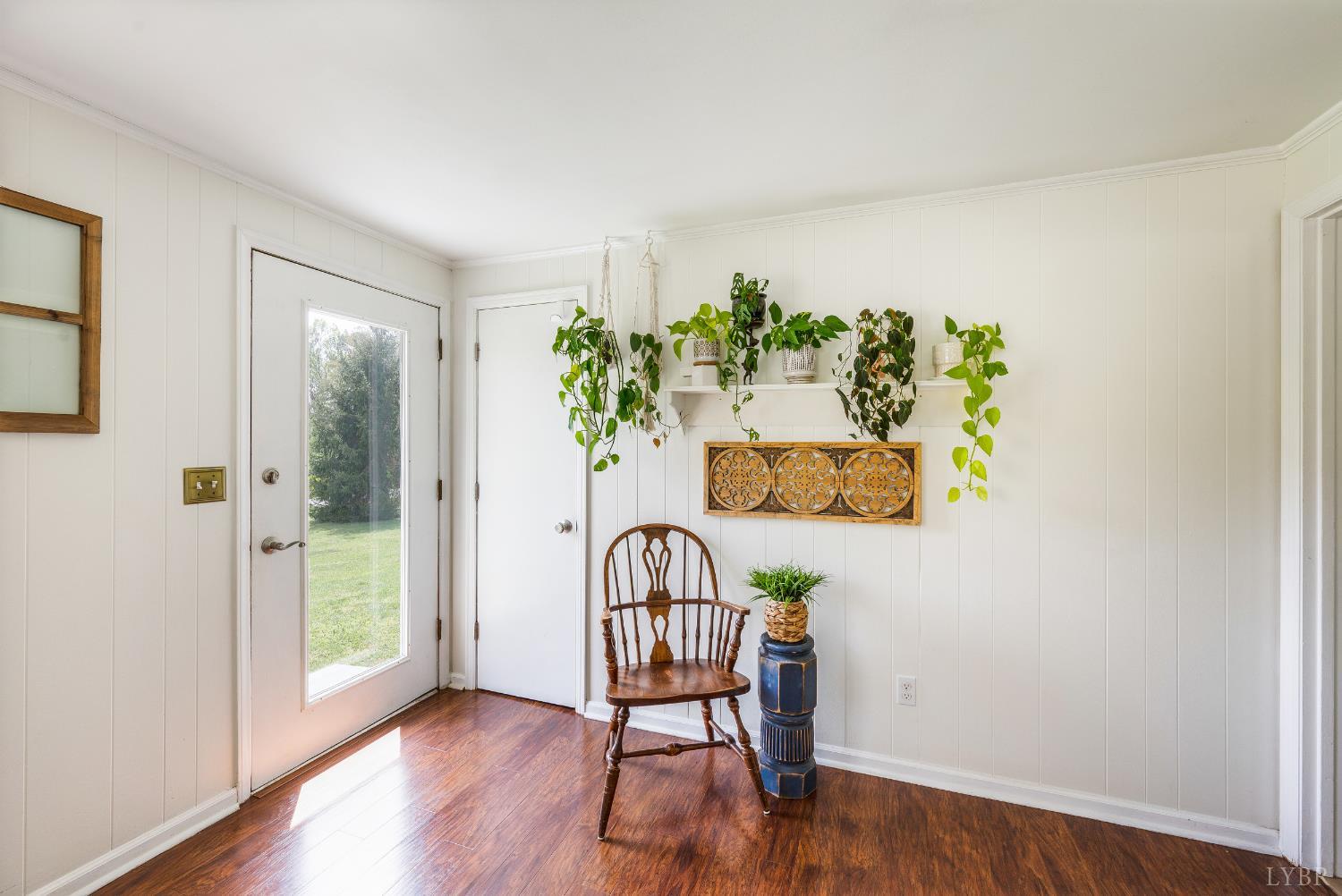 18 Witt Road Evington, VA 24550 - Photo 6 of 43 a view of a hallway with wooden floor and a potted plant