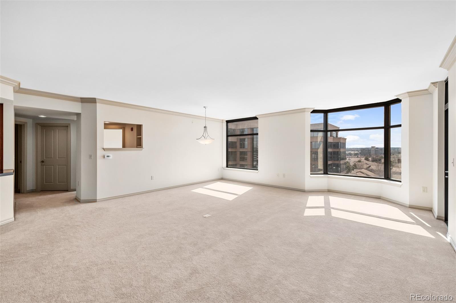 8100 East Union Avenue, Unit 814 Denver, CO 80237 - Photo 13 of 38 an empty room with windows and entrance