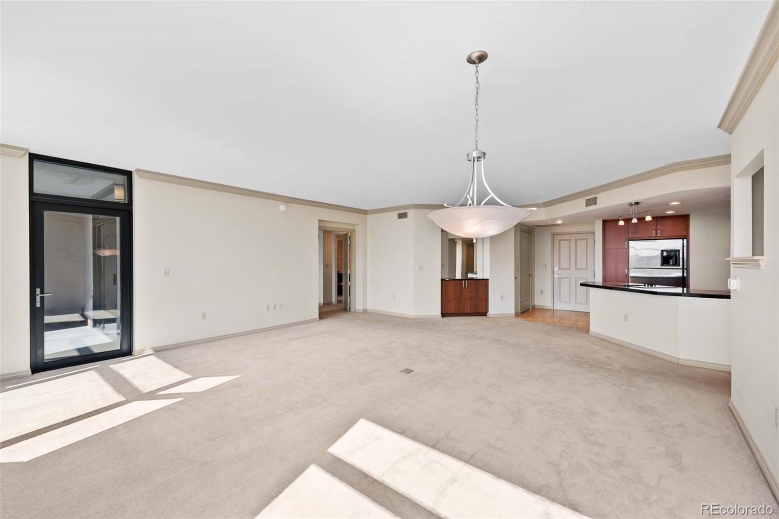 8100 East Union Avenue, Unit 814 Denver, CO 80237 - Photo 16 of 38 a view of a room with a windows and ceiling fan