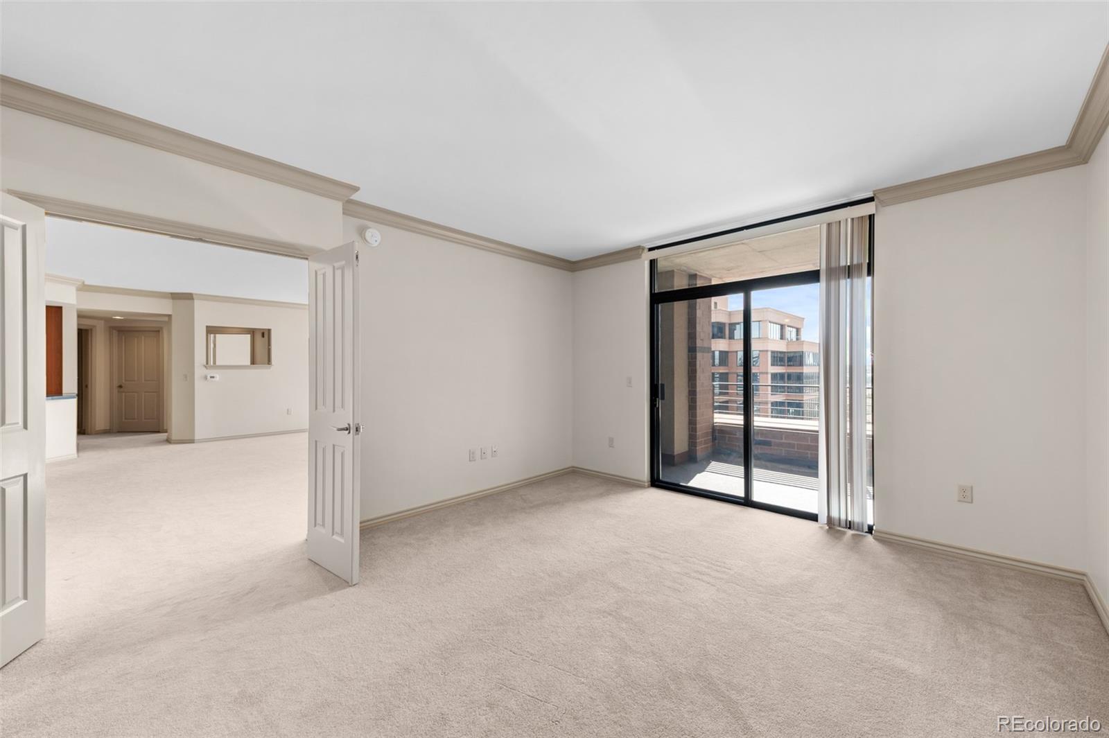 8100 East Union Avenue, Unit 814 Denver, CO 80237 - Photo 19 of 38 a view of an empty room with a window