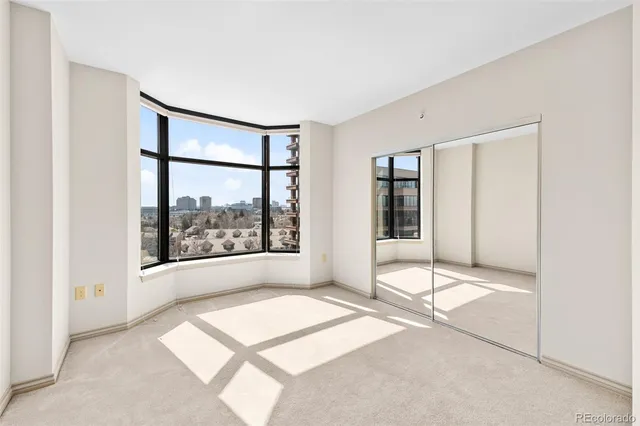 a view of a balcony with a floor to ceiling window