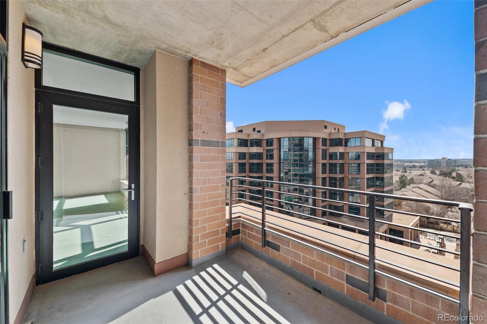8100 East Union Avenue, Unit 814 Denver, CO 80237 - Photo 29 of 38 a view of a balcony with a floor to ceiling window