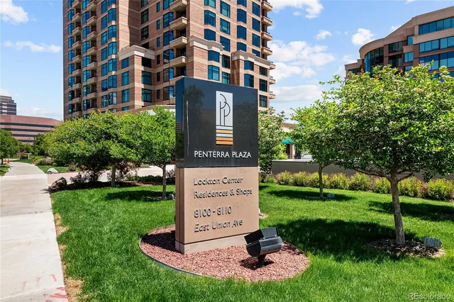 a view of a building with a yard