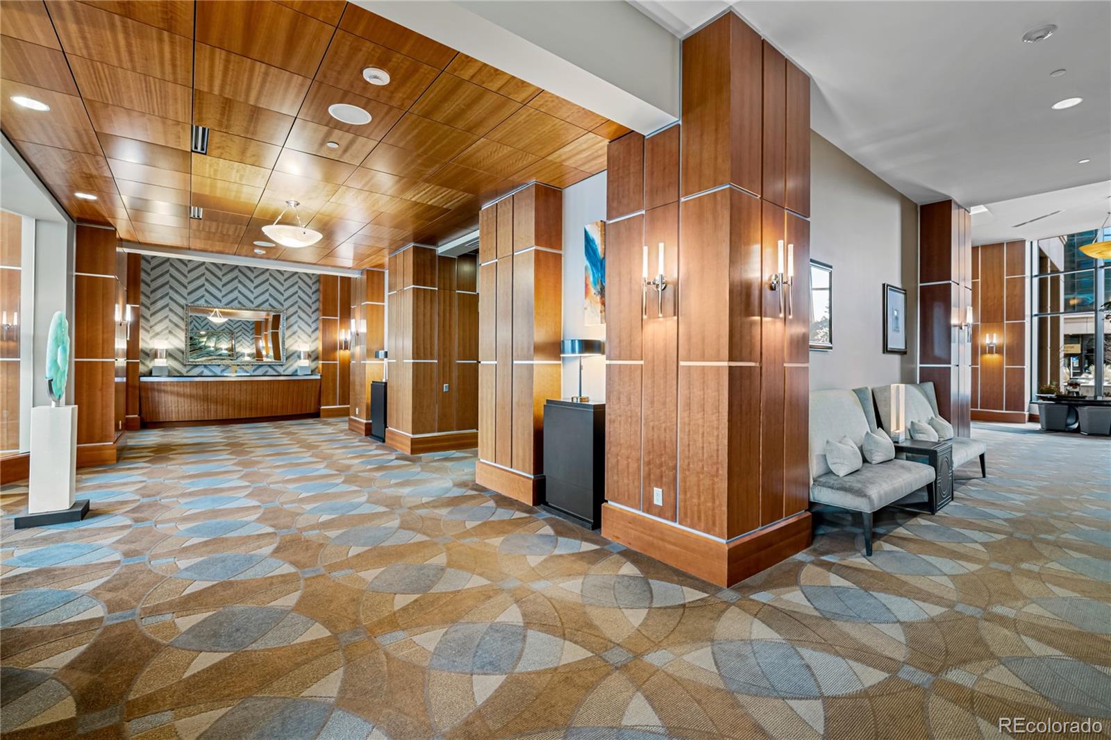 8100 East Union Avenue, Unit 814 Denver, CO 80237 - Photo 7 of 38 a view of a hallway with wooden floor and furniture