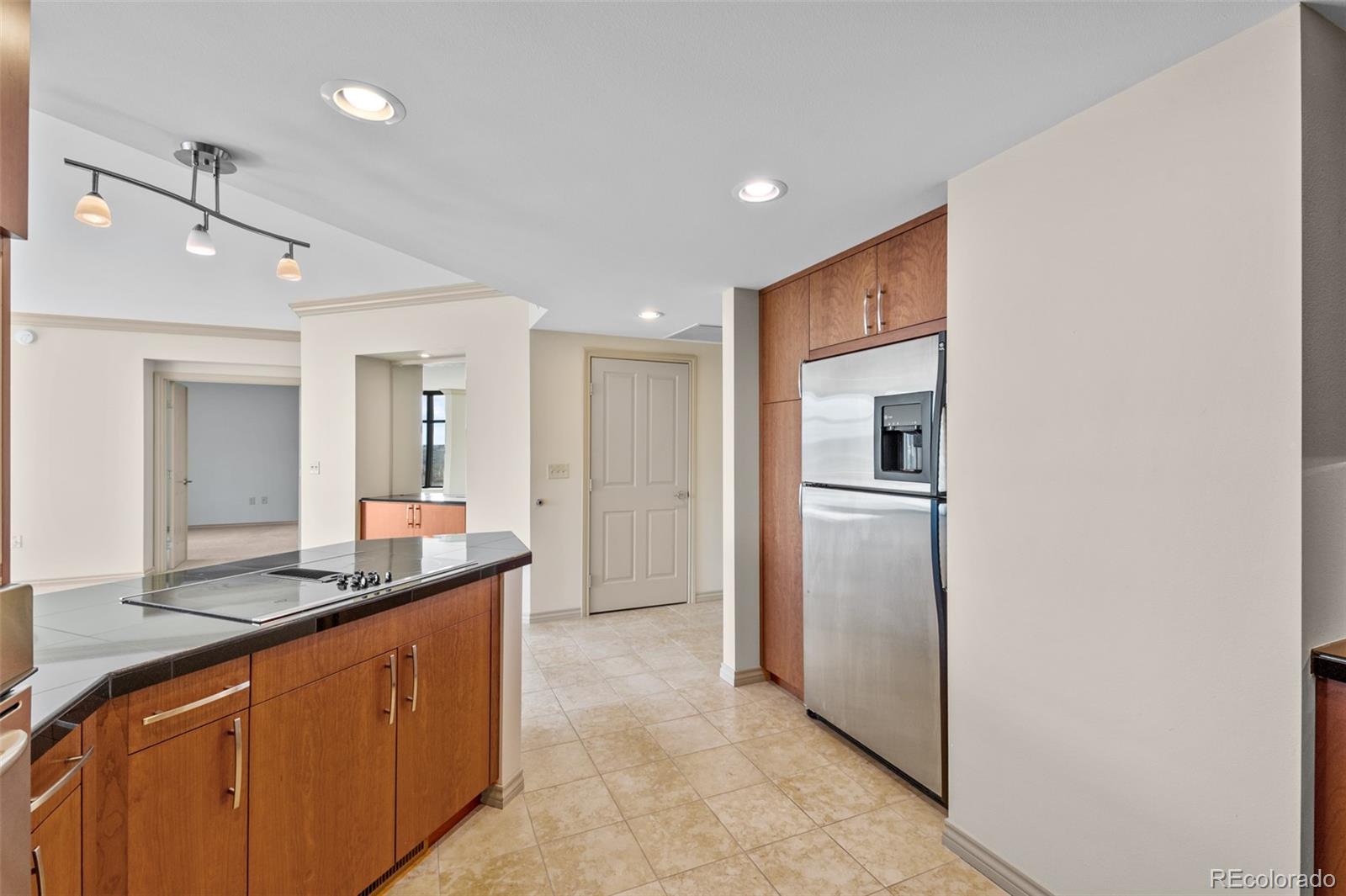 8100 East Union Avenue, Unit 814 Denver, CO 80237 - Photo 10 of 38 a kitchen with refrigerator cabinets and a sink