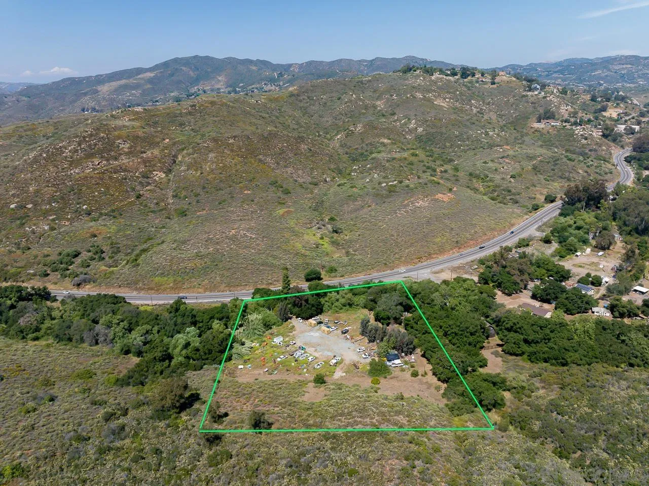 13455 Campo Road, Unit 5960314300 Jamul, CA 91935 - Photo 2 of 10 an aerial view of mountains residential house and green space