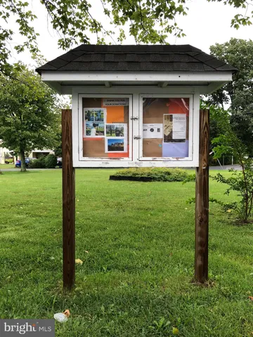 a view of a car park in front of house