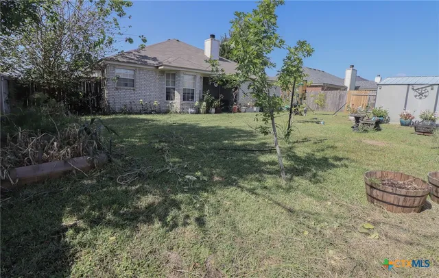 a view of a big yard next to a house