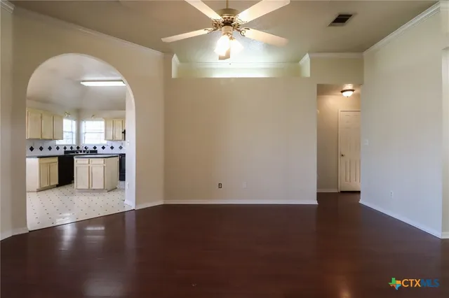 a view of a kitchen with a sink and a window