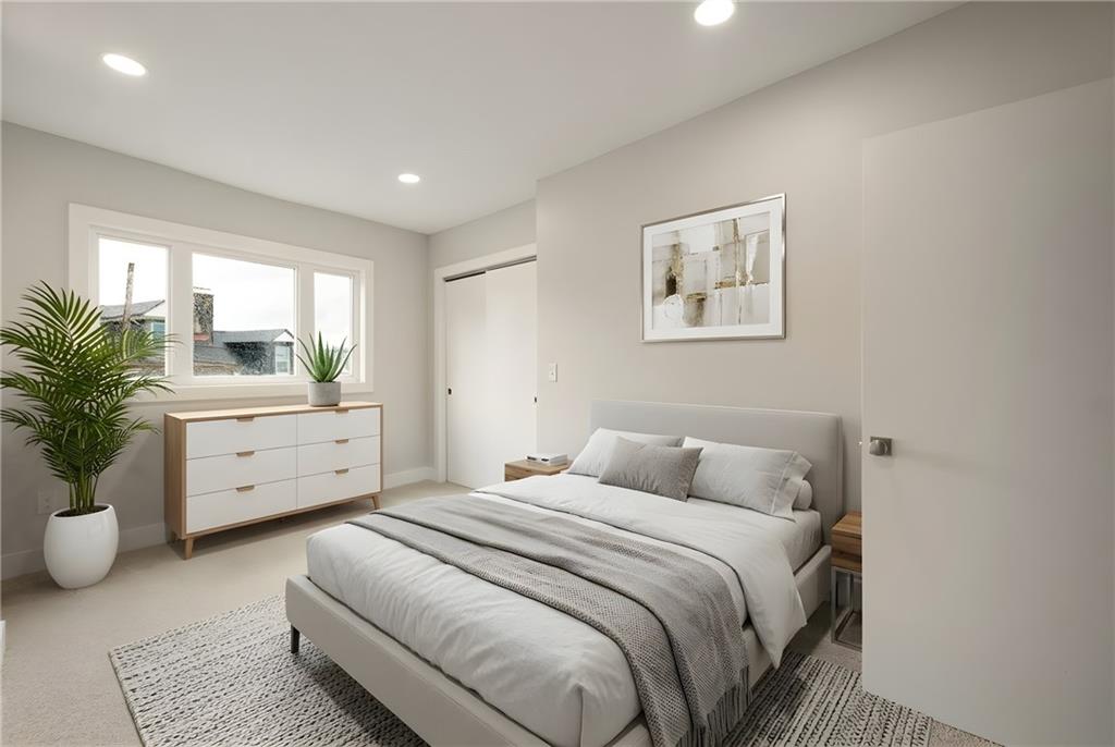 807 McCandless Avenue Pittsburgh, PA 15201 - Photo 11 of 24 a bedroom with a large bed and a potted plant