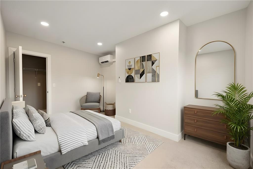 807 McCandless Avenue Pittsburgh, PA 15201 - Photo 12 of 24 a bedroom with bed and a potted plant