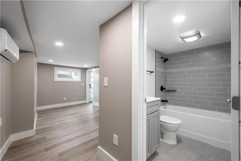 a bathroom with a toilet a sink and bathtub