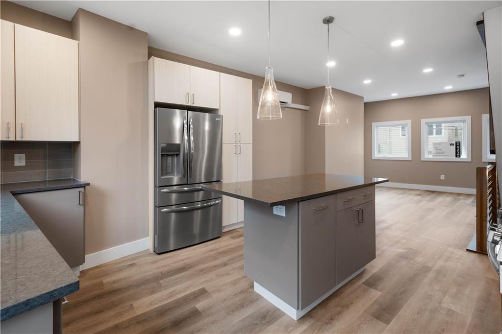 807 McCandless Avenue Pittsburgh, PA 15201 - Photo 4 of 24 a kitchen with stainless steel appliances granite countertop a refrigerator and a stove top oven