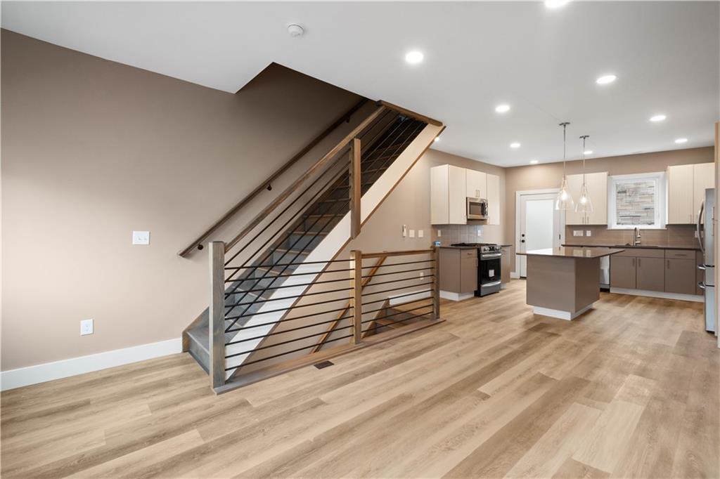 807 McCandless Avenue Pittsburgh, PA 15201 - Photo 9 of 24 a view of kitchen with wooden floor and electronic appliances