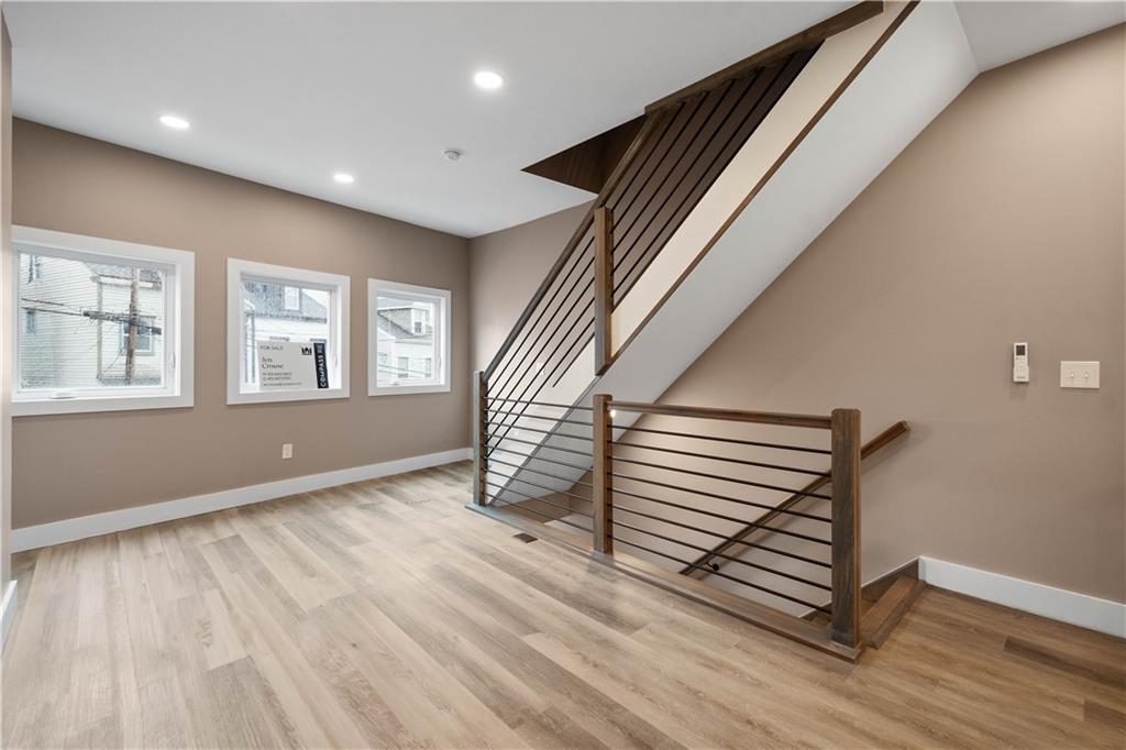 807 McCandless Avenue Pittsburgh, PA 15201 - Photo 10 of 24 a view of an empty room with wooden floor and stairs