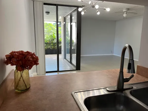 a room with gym equipment and a large window