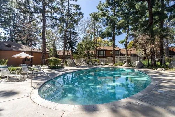 a view of a swimming pool with a patio