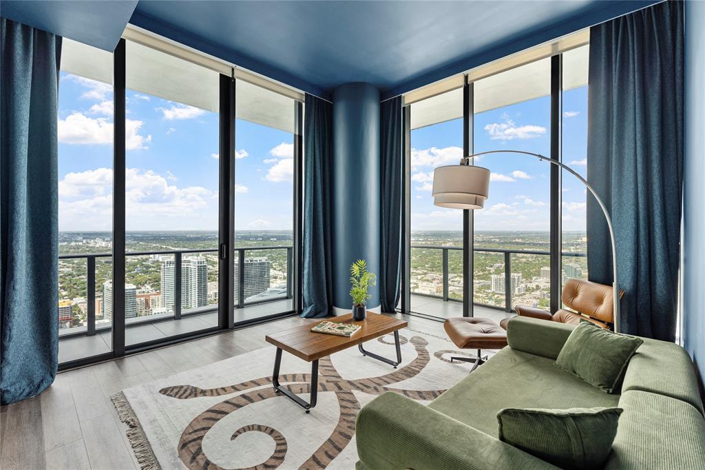 480 Northeast 31st Street, Unit 5104A Miami, FL 33137 - Photo 19 of 26 a living room with furniture and floor to ceiling windows