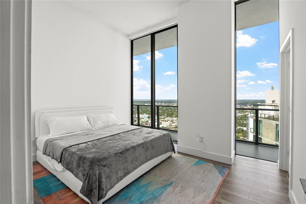 480 Northeast 31st Street, Unit 5104A Miami, FL 33137 - Photo 23 of 26 a bedroom with a bed and a window