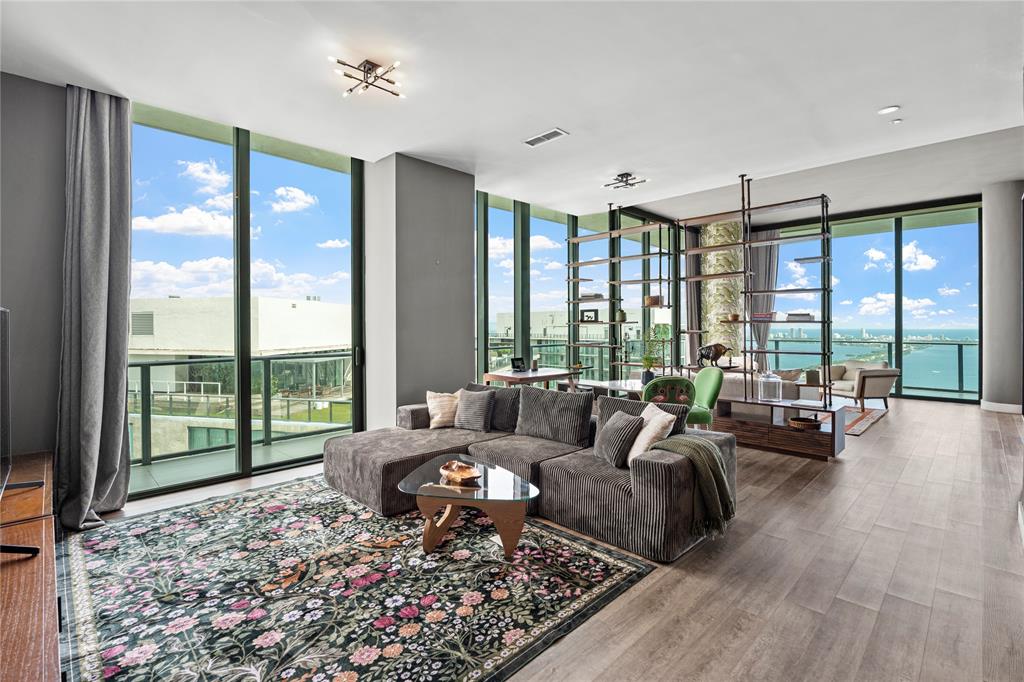 480 Northeast 31st Street, Unit 5104A Miami, FL 33137 - Photo 6 of 26 a living room with furniture and a large window