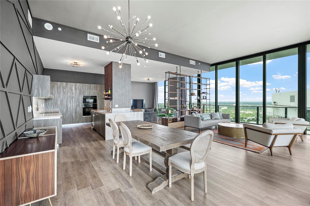 480 Northeast 31st Street, Unit 5104A Miami, FL 33137 - Photo 9 of 26 a view of a dining room with furniture window and wooden floor