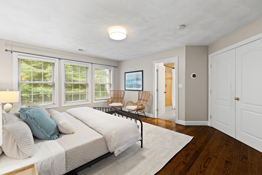 58 Mansfield Road Lynnfield, MA 01940 - Photo 18 of 42 a spacious bedroom with a bed and wooden floor