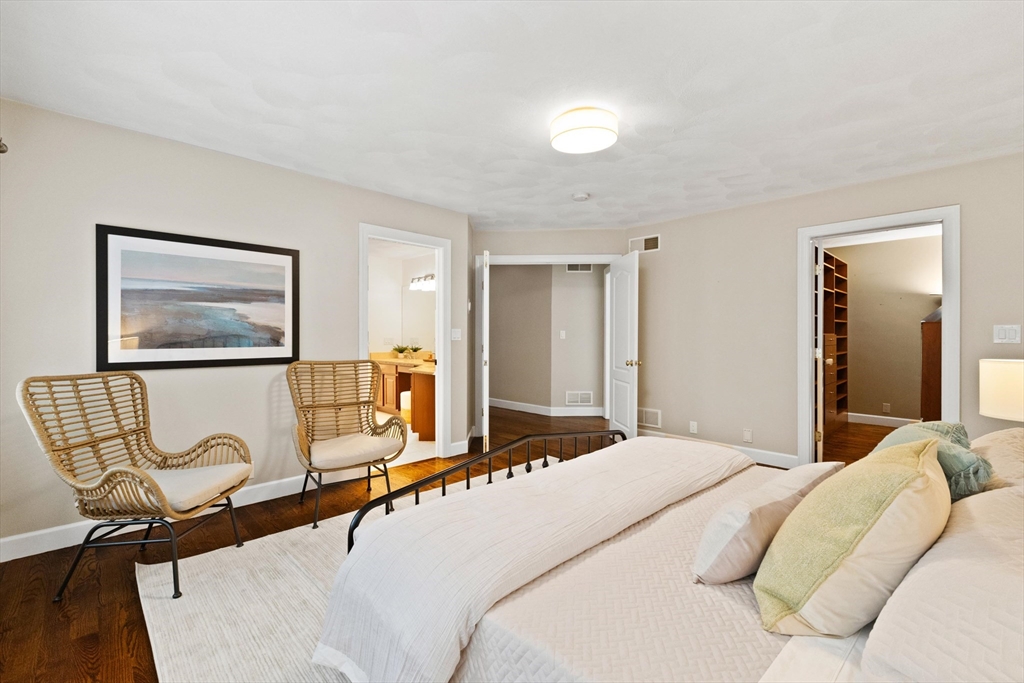 58 Mansfield Road Lynnfield, MA 01940 - Photo 19 of 42 a bedroom with a bed and dresser with wooden floor