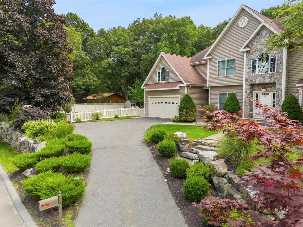 58 Mansfield Road Lynnfield, MA 01940 - Photo 2 of 42 a front view of a house with garden