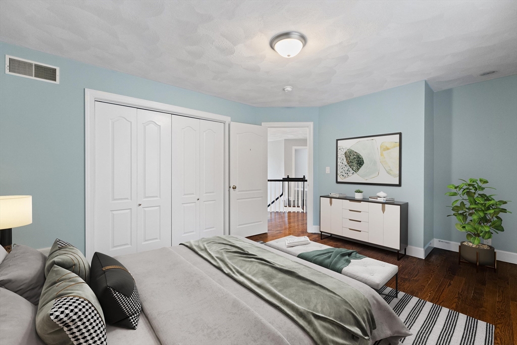 58 Mansfield Road Lynnfield, MA 01940 - Photo 27 of 42 a bedroom with a bed and a potted plant