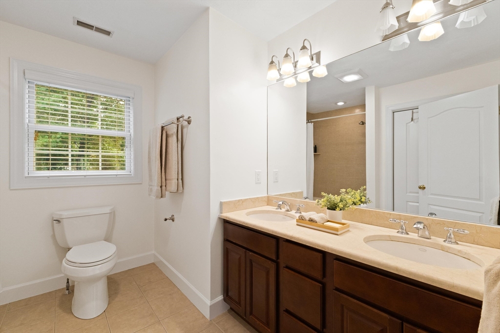 58 Mansfield Road Lynnfield, MA 01940 - Photo 28 of 42 a bathroom with a sink double vanity and a mirror