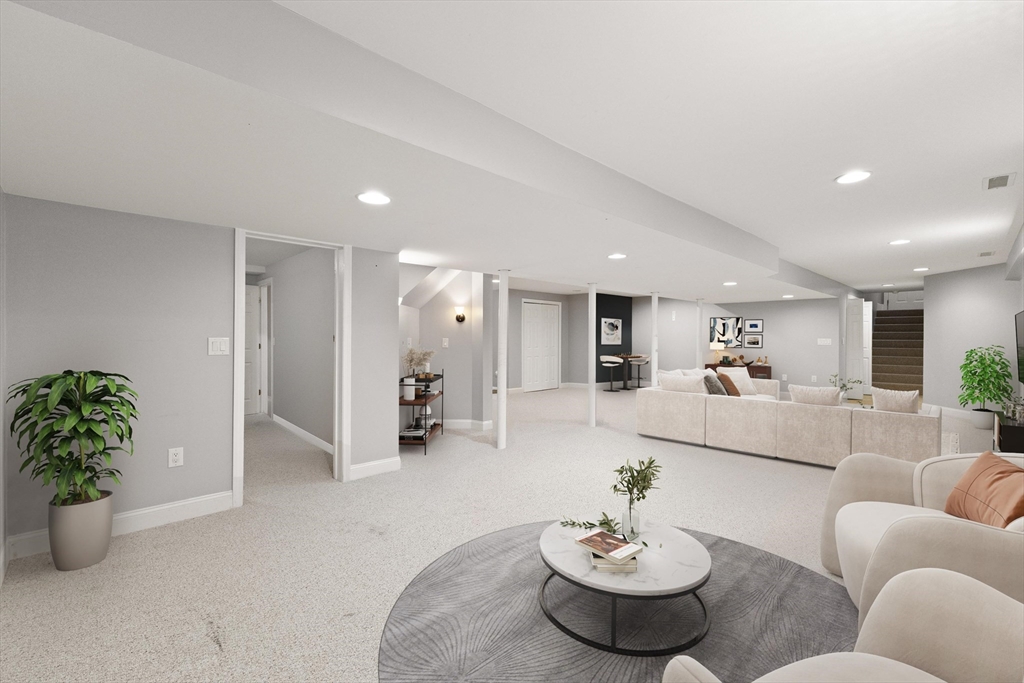 58 Mansfield Road Lynnfield, MA 01940 - Photo 32 of 42 a living room with furniture and a potted plant