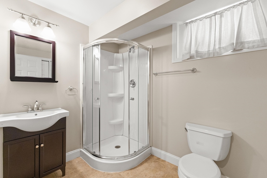 58 Mansfield Road Lynnfield, MA 01940 - Photo 34 of 42 a bathroom with a sink a toilet and shower