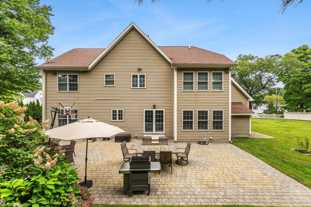 58 Mansfield Road Lynnfield, MA 01940 - Photo 36 of 42 a view of a house with pool and chairs