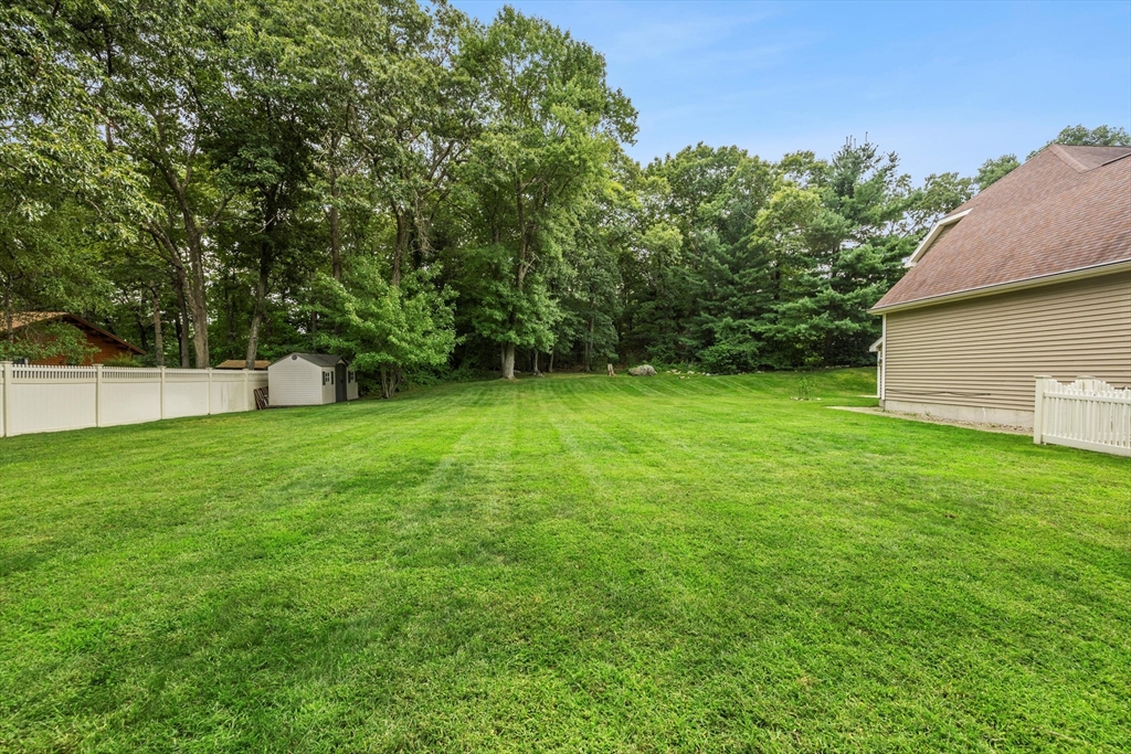 58 Mansfield Road Lynnfield, MA 01940 - Photo 38 of 42 a view of a backyard with a garden